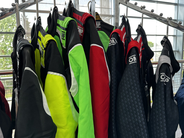 A colourful selection of race suits in the Grand Prix Racewear showroom