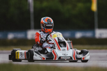 Clickable image of a driver racing in an outdoor track kart