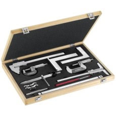 Set of precision tools including wrenches, screwdrivers, and measuring instruments in a wooden case, ideal for mechanics and racewear maintenance.