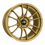 High-performance gold racing wheel rim for motorsport, designed for durability and lightweight handling in Grand Prix racewear applications.