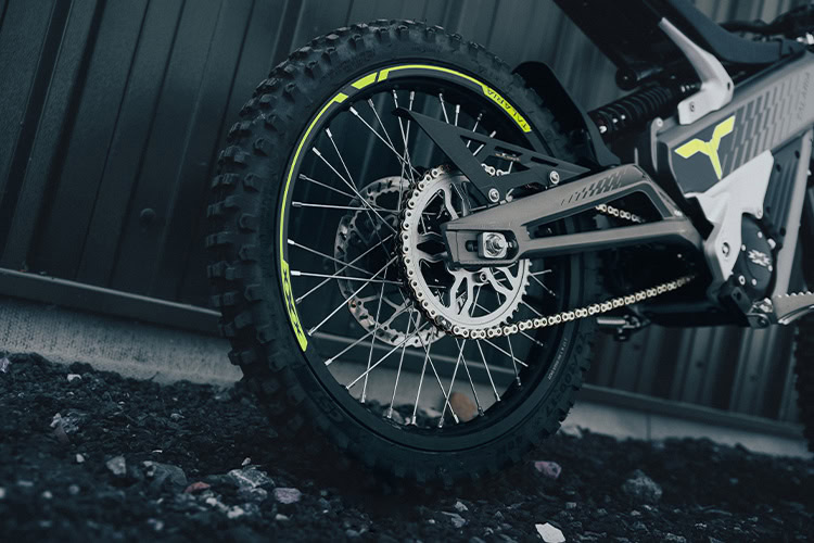 Close-up of a high-performance electric mountain bike wheel with disc brake and rugged tyre for off-road riding.