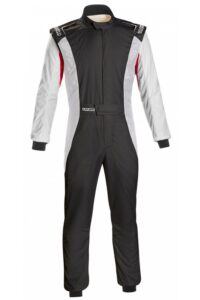 Grand Prix Racewear racing suit with black, white, and red design, featuring sponsor logos and protective padding for motorsport drivers.