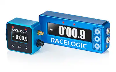 Racelogic lap timer and data logger for motorsport, featuring a digital display and compact design, used for precise timing and performance analysis.