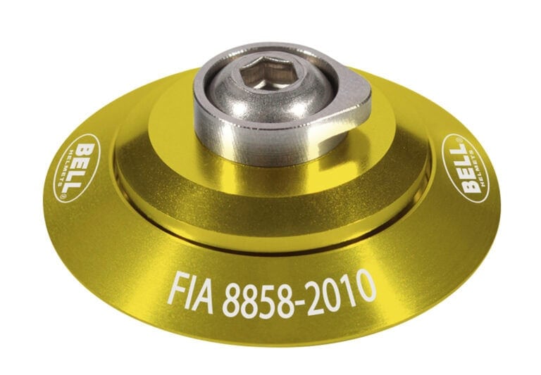 Yellow FIA 8858-2010 racing part with Bell branding, designed for Grand Prix racewear safety equipment.