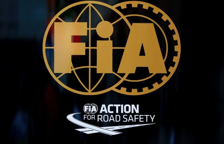 FIA Action for Road Safety logo featuring a globe, gear, and the FIA acronym, promoting road safety initiatives.