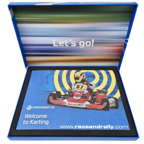 Grand Prix Racewear karting set with a go-kart and racing accessories in a blue box for kids and beginners.