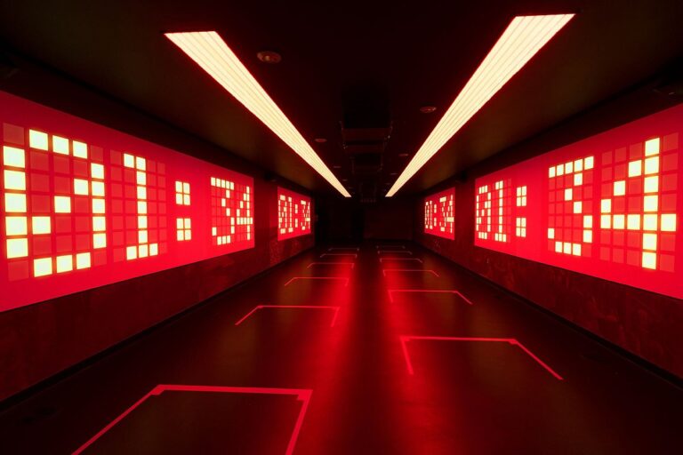 Futuristic digital countdown display with red LED numbers in a dark tunnel, creating a high-tech atmosphere.