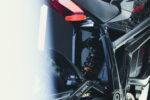 Close-up of the Talaria Sting Pro 72v 40ah electric motorcycle's rear suspension and frame, highlighting its sleek design and high-performance components.