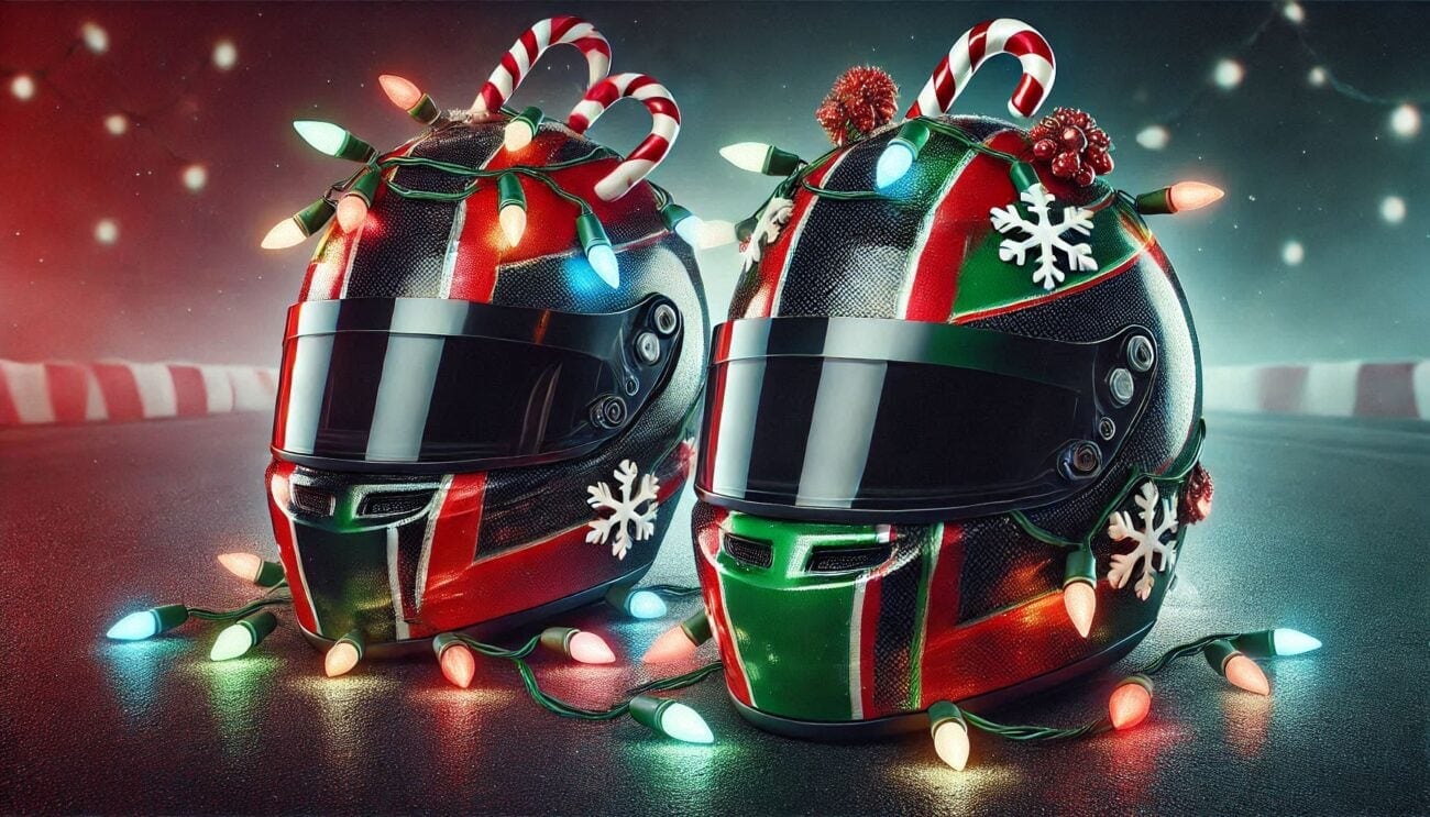 Two racing helmets decorated with Christmas ornaments and lights, celebrating festive spirit in motorsport.