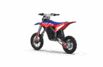 Grand Prix Racewear electric dirt bike with red, blue, and white design, suitable for young riders, featuring a compact frame and off-road tires.