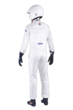 Professional racing driver in white Grand Prix Racewear suit with helmet, gloves, and racing shoes, ready for motorsport competition.