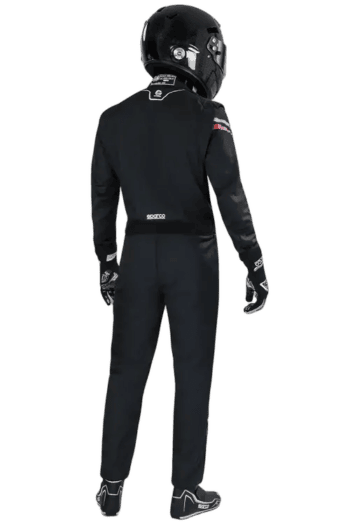 Professional racing driver in Grand Prix Racewear with helmet, suit, and gloves, ready for motorsport competition.
