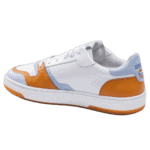 White and orange Grand Prix Racewear sneaker with blue accents, designed for motorsport enthusiasts and racers.