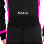 Close-up of a black Sparco racing suit with pink and white accents, designed for motorsport safety and performance.