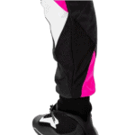 Close-up of a racing pant with black, white, and pink panels, designed for Grand Prix racewear, showing durable fabric and ergonomic fit.
