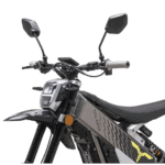 Close-up of an electric motorcycle with handlebars, mirrors, and a digital display, showcasing modern design and advanced features for racing and recreational use.