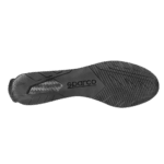 Close-up of a black Sparco racing shoe sole with tread pattern and branding for motorsport safety and performance.