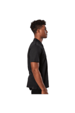 Side view of a young man wearing a black Grand Prix Racewear polo shirt, showcasing professional motorsport apparel.