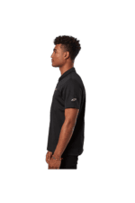Side view of a young man wearing a black Grand Prix Racewear polo shirt, showcasing racing apparel for motorsport enthusiasts.