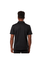 Back view of a person wearing a black Grand Prix Racewear racing shirt, showcasing professional motorsport apparel.