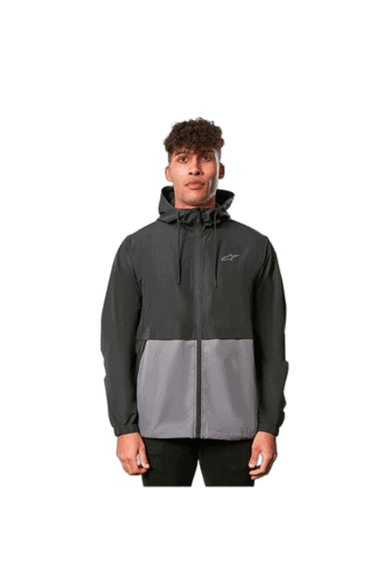 Young man wearing a black and grey Grand Prix Racewear jacket, suitable for motorsport activities.