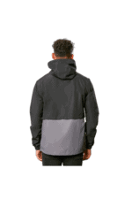 Back view of a person wearing a black and grey Grand Prix Racewear jacket, suitable for motorsport events.