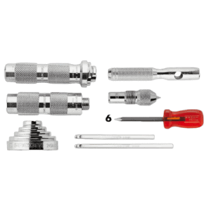 Facom punch and caliper accessories set with various tools including punches, calipers, and screwdrivers on a black background.