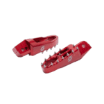 Red Grand Prix Racewear footrest with metal studs for motorcycle racing, designed for safety and grip.
