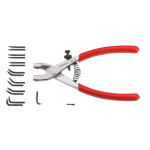 Set of racing tools including pliers, screws, and a small wrench, used for Grand Prix racewear maintenance and repairs.
