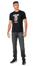 Young man wearing a black Grand Prix Racewear T-shirt with racing logo, standing confidently against a plain background.