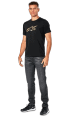 Young man wearing Grand Prix Racewear T-shirt with Alpinestars logo, standing confidently against a plain background.