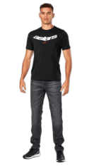 Young man wearing a black Astars T-shirt and jeans, standing confidently against a plain background.