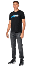 Young man wearing Grand Prix Racewear T-shirt, standing confidently, promoting motorsport apparel and accessories.