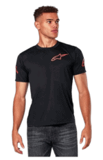 Young man wearing black Grand Prix Racewear T-shirt with Alpinestars logo, standing outdoors.