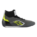 High-performance racing shoe from Grand Prix Racewear with black, grey, and neon yellow accents, designed for motorsport enthusiasts and professional drivers.