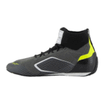 High-performance racing shoe from Grand Prix Racewear with black, grey, and neon yellow accents, designed for motorsport enthusiasts.