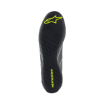 Alpinestars racing shoe sole with black, yellow, and grey design, featuring the Alpinestars logo and 'alpinestars' branding for motorsport safety gear.