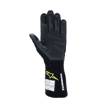 Black racing glove with yellow logo and protective padding, designed for motorsport safety and performance.