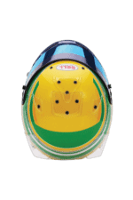 Close-up of a racing helmet with yellow, green, and blue design, featuring Bell logo, used in motorsport events.