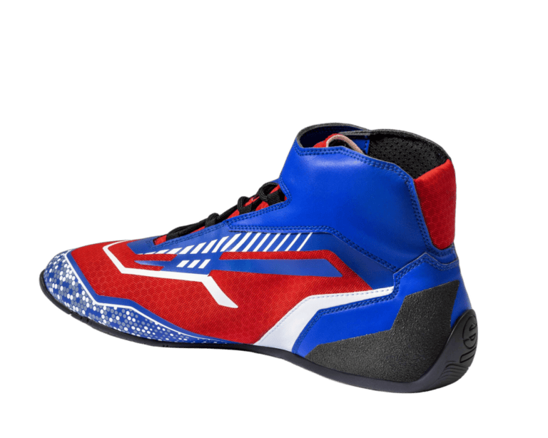 Grand Prix Racewear racing shoe in red, blue, black, and white with high ankle support and grip sole for motorsport safety.