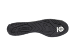Close-up of a black Sparco racing shoe sole with tread pattern and white logo, designed for motorsport safety and performance.