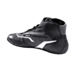 High-performance Grand Prix racing shoe with black, white, and grey design, featuring advanced grip and support for motorsport drivers.