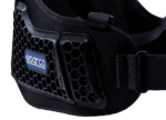 Close-up of a black Sparco racing harness with honeycomb design, used for safety in motorsport events.