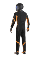 Professional racing driver in Grand Prix Racewear with helmet and suit, ready for motorsport competition.
