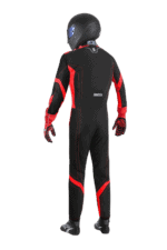 Full-body view of a professional racing driver in black and red Grand Prix Racewear suit with helmet and gloves, ready for motorsport competition.
