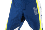 Close-up of blue Grand Prix Racewear motocross pants with HCB branding and yellow accents, designed for professional racing.