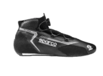 Black Sparco racing shoe with quick-lace system and high ankle support, designed for motorsport safety and performance.