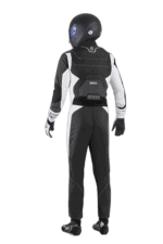 Professional racing driver in Grand Prix Racewear with helmet and suit, ready for motorsport competition.