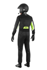 Professional racing driver in black and neon green Grand Prix Racewear suit with helmet, gloves, and racing shoes, ready for motorsport competition.