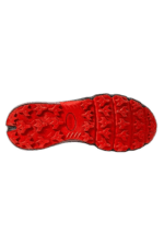 Close-up of a red Grand Prix Racewear racing shoe sole with textured grip pattern for motorsport safety and performance.